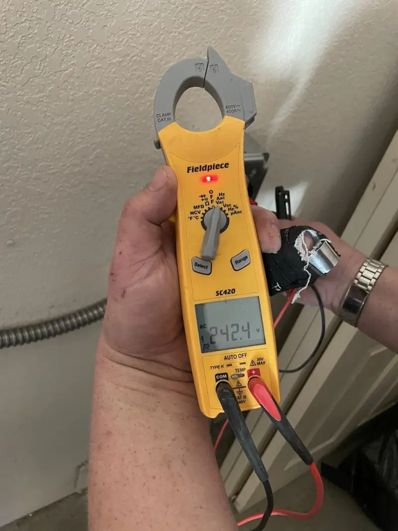 Voltage testing with clamp meter during Aluminum Wiring Replacement in Green